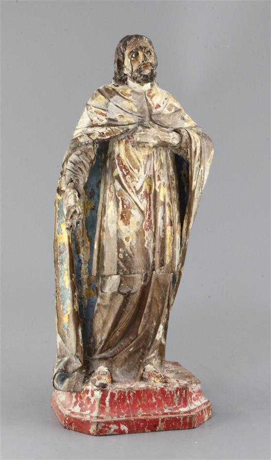 A Brazilian gilt and polychrome-painted carved wood figure of a saint, 18th century, height 17in.